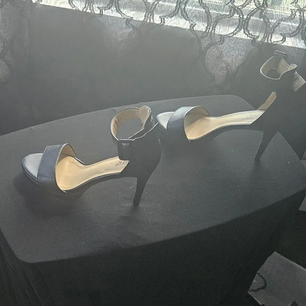 Source Unknown black leather